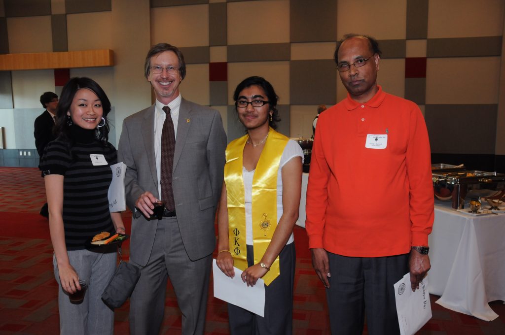 (From left to right) Faustina Tran, Peter Starkweather (Dean of the Honors College), Shipra De (winner of the Robert C. Maxson Graduate Fellowship) and Professor Pradip Bhowmik enjoy the Phi Kappa Phi reception